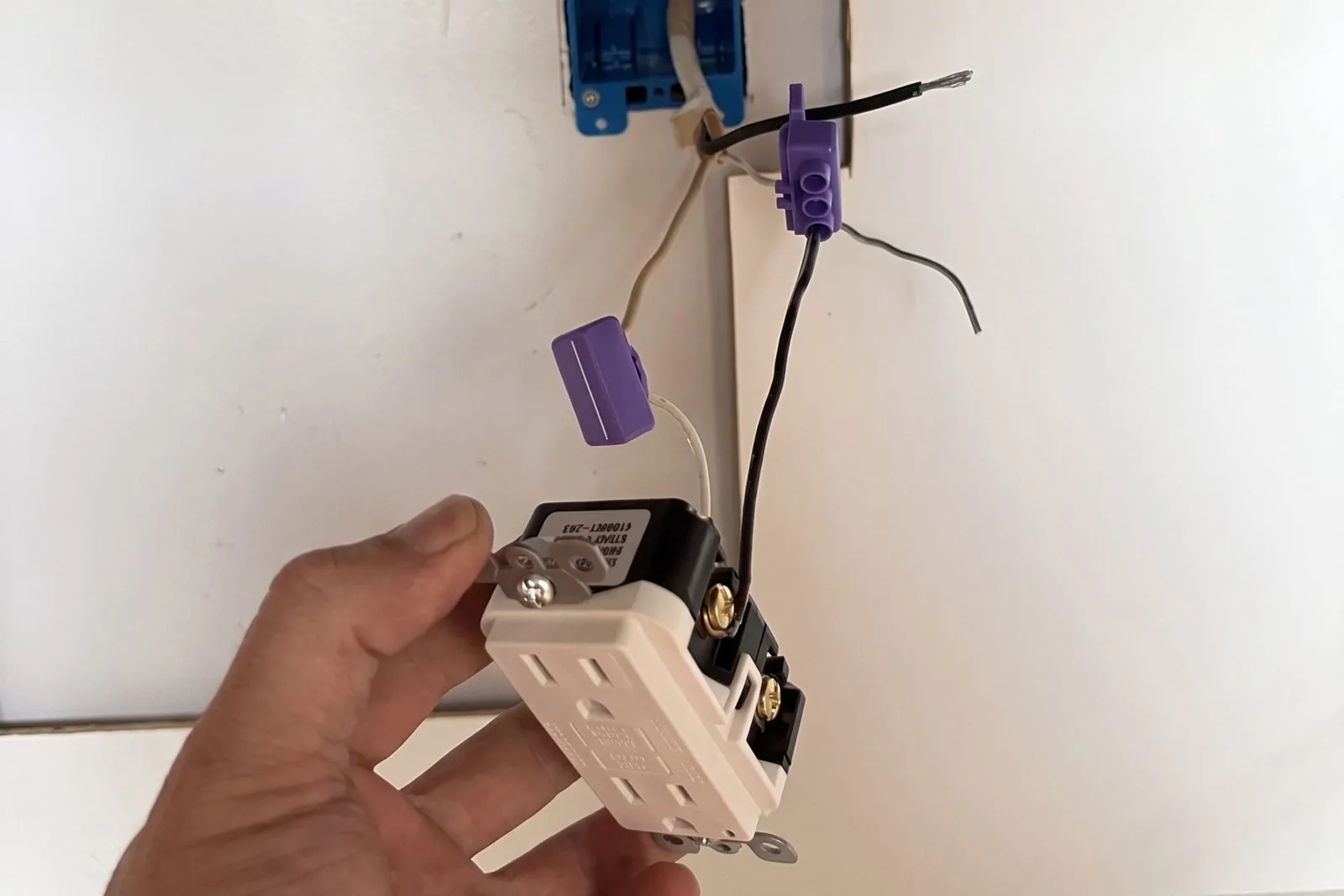 Receptacle pigtailed with purple AlumiConn aluminum-to-copper lugs before it goes back in the box