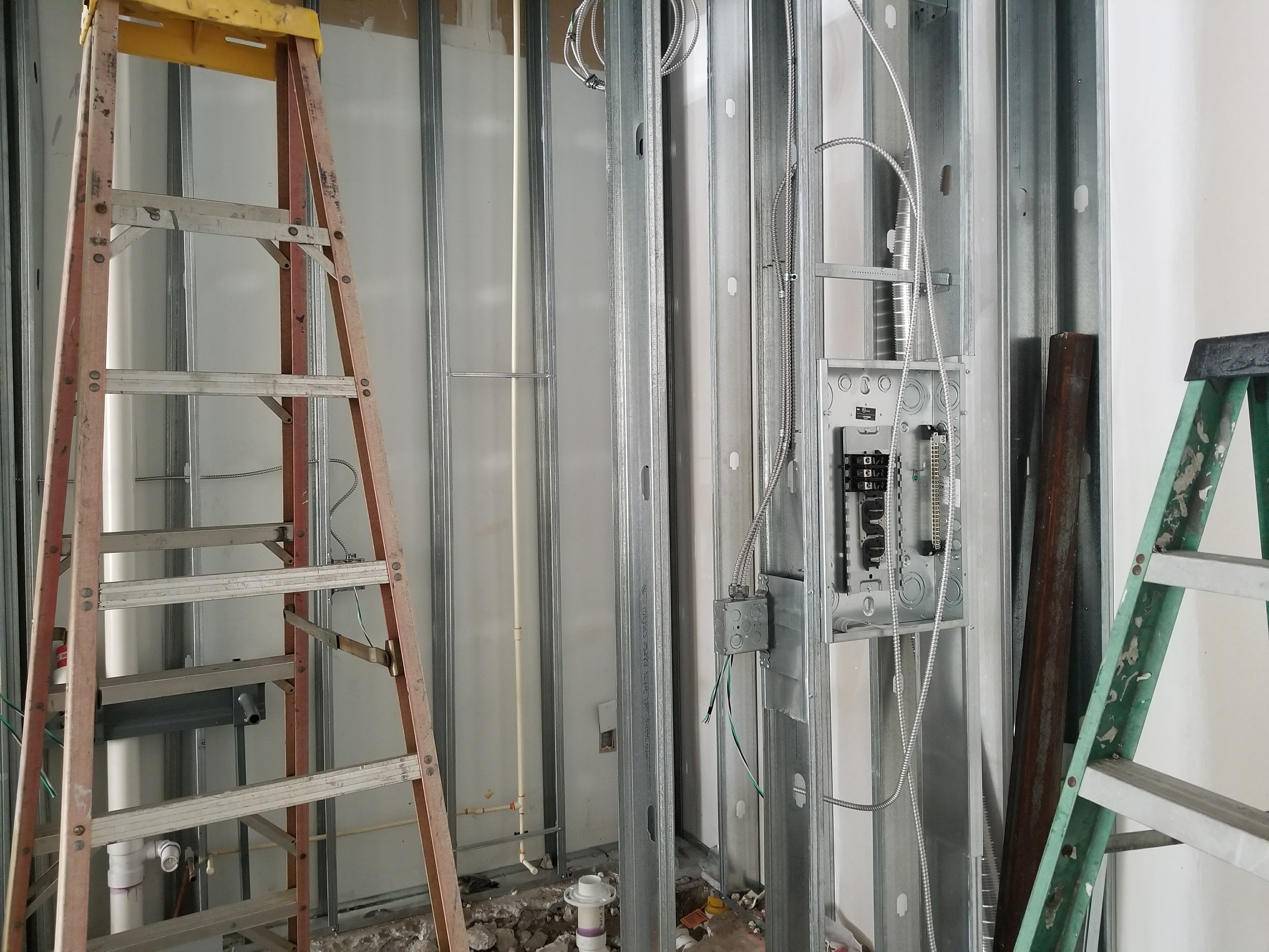 Commercial electrical rough-in through steel stud framing in Tampa Bay