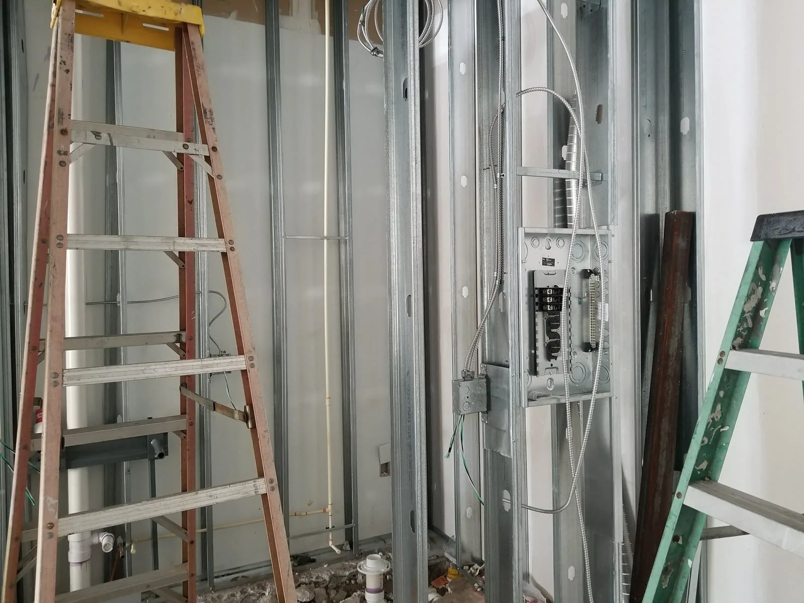 Commercial electrical rough-in through steel stud framing in Tampa Bay