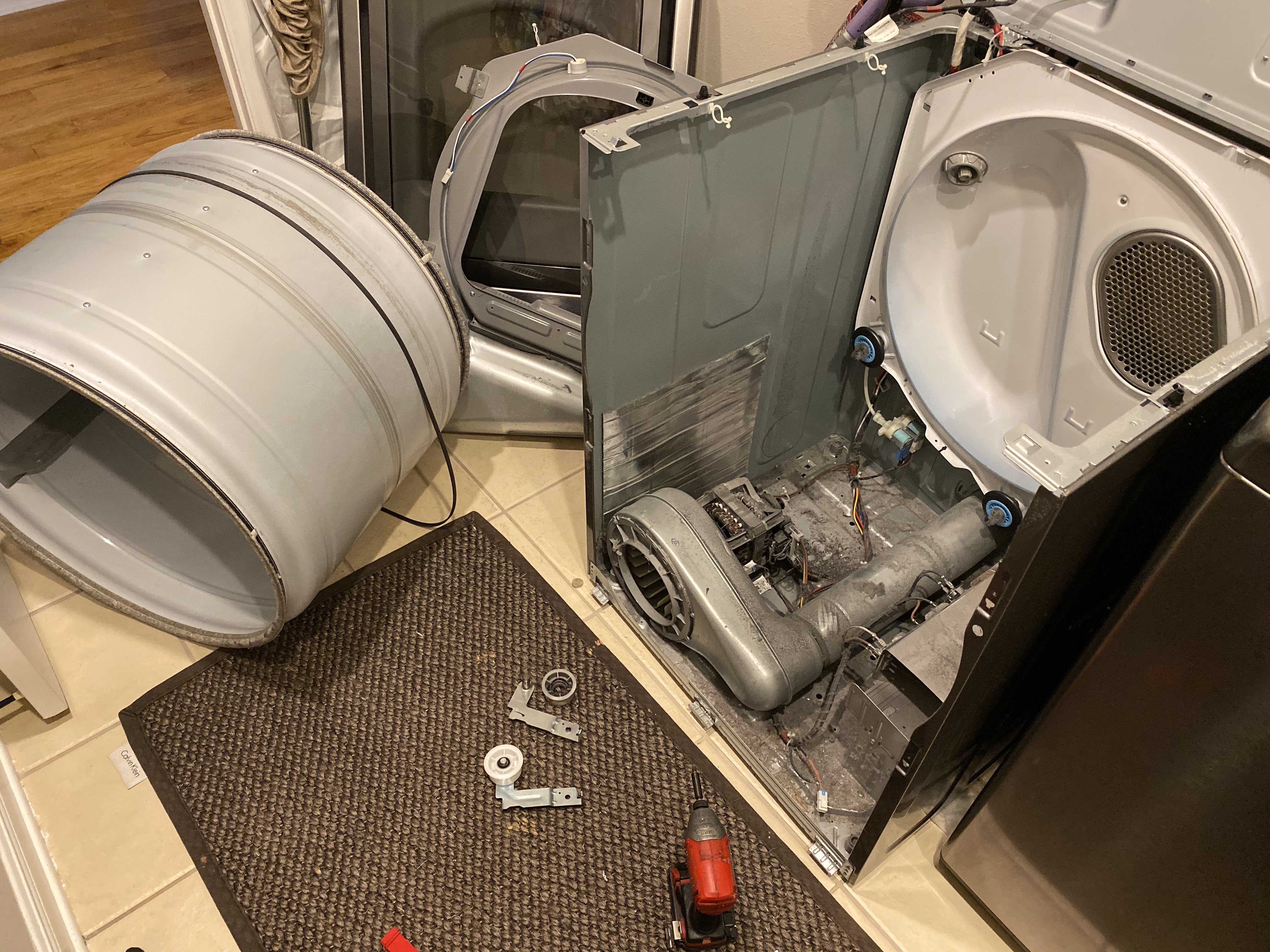 Dryer drum removed exposing the blower and components near Tampa Bay