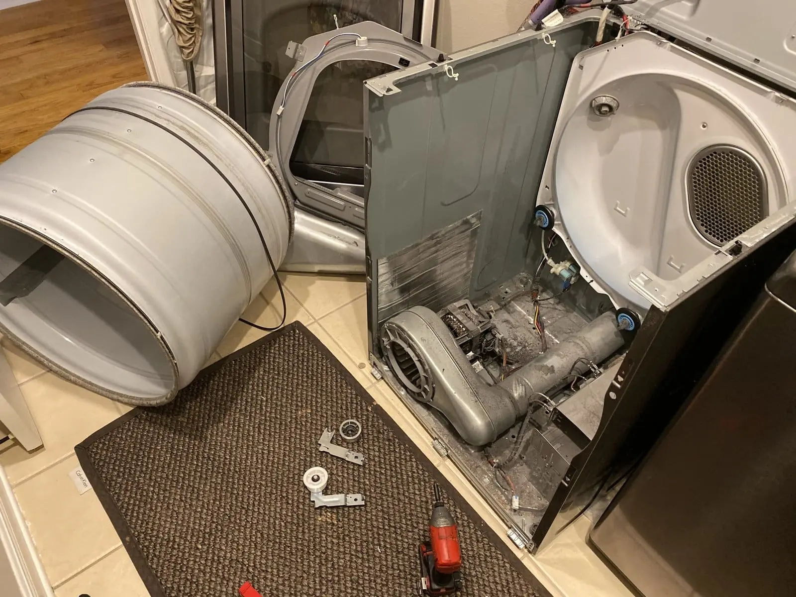Dryer drum removed exposing the blower and components near Tampa Bay