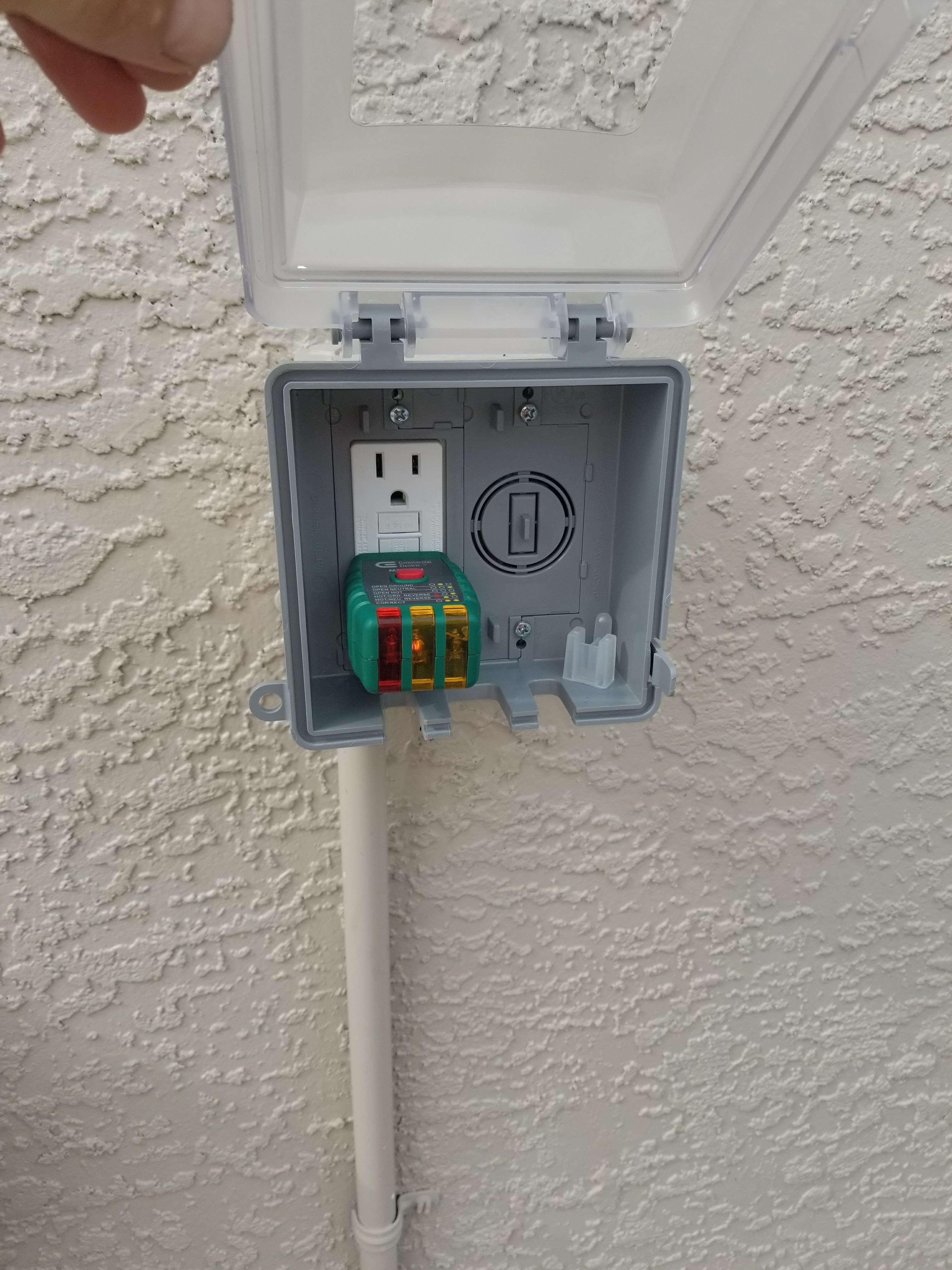 GFCI outlet tested with a circuit tester during a Tampa Bay electrical repair