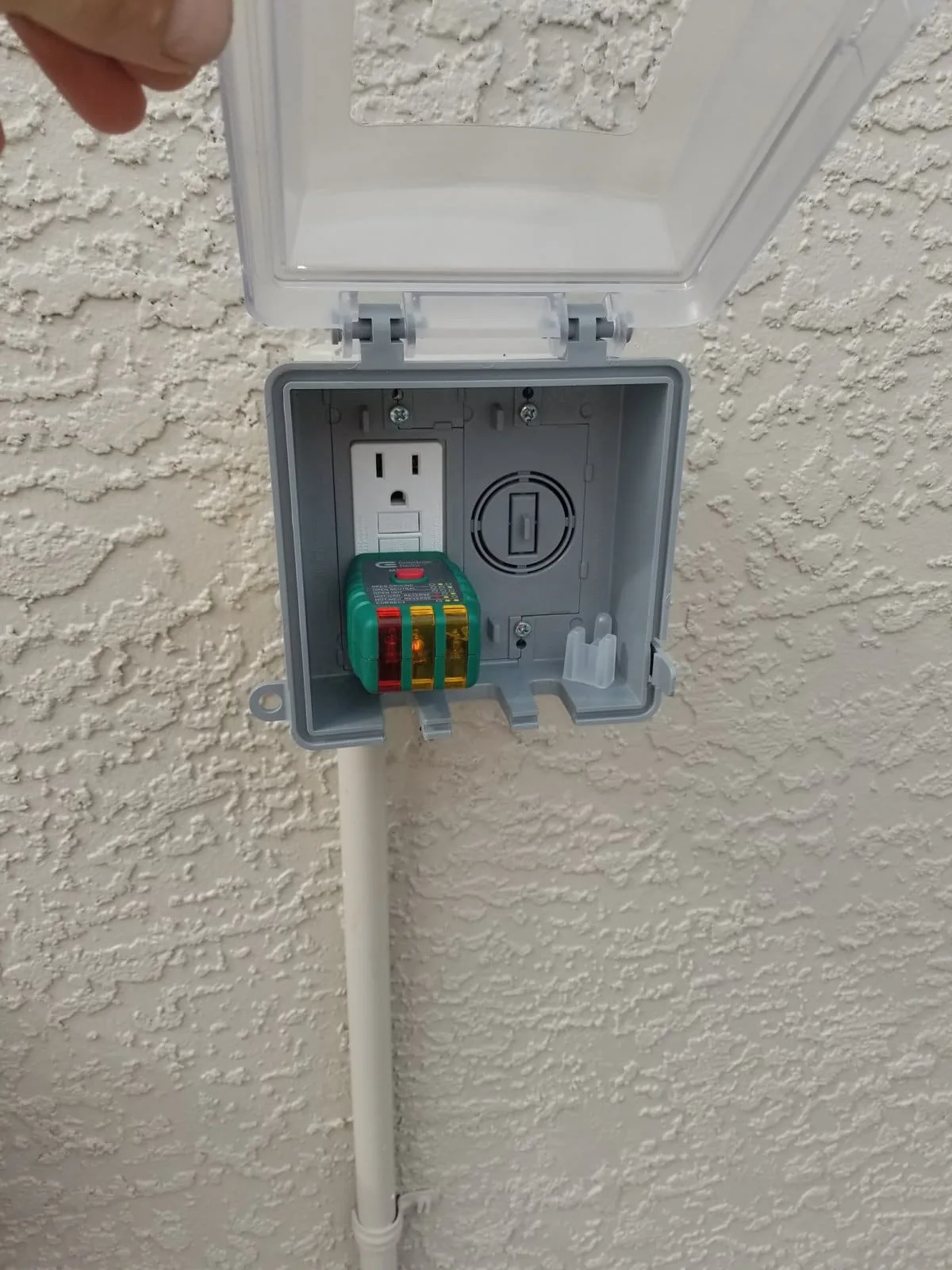 GFCI outlet tested with a circuit tester during a Tampa Bay electrical repair