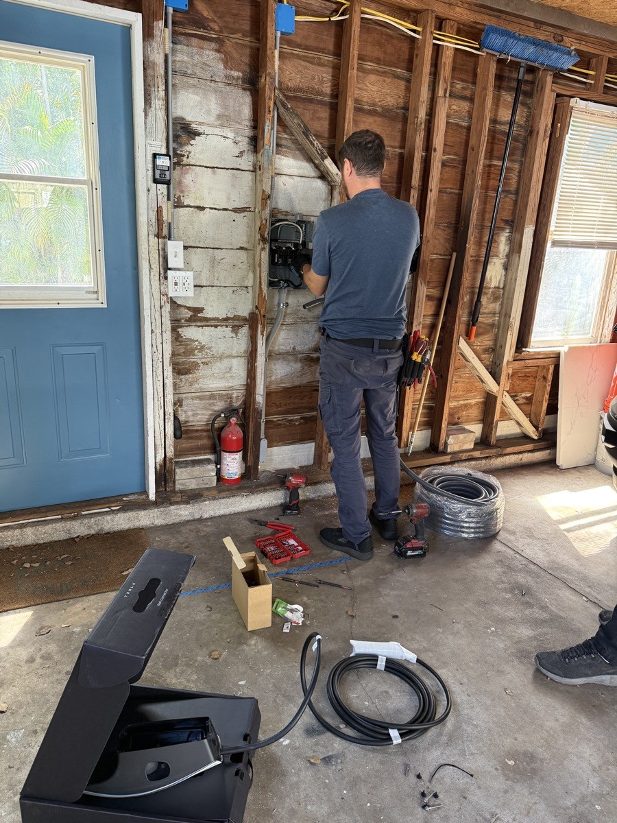Conduit and wiring run for an EV charger installation in a Tampa Bay garage