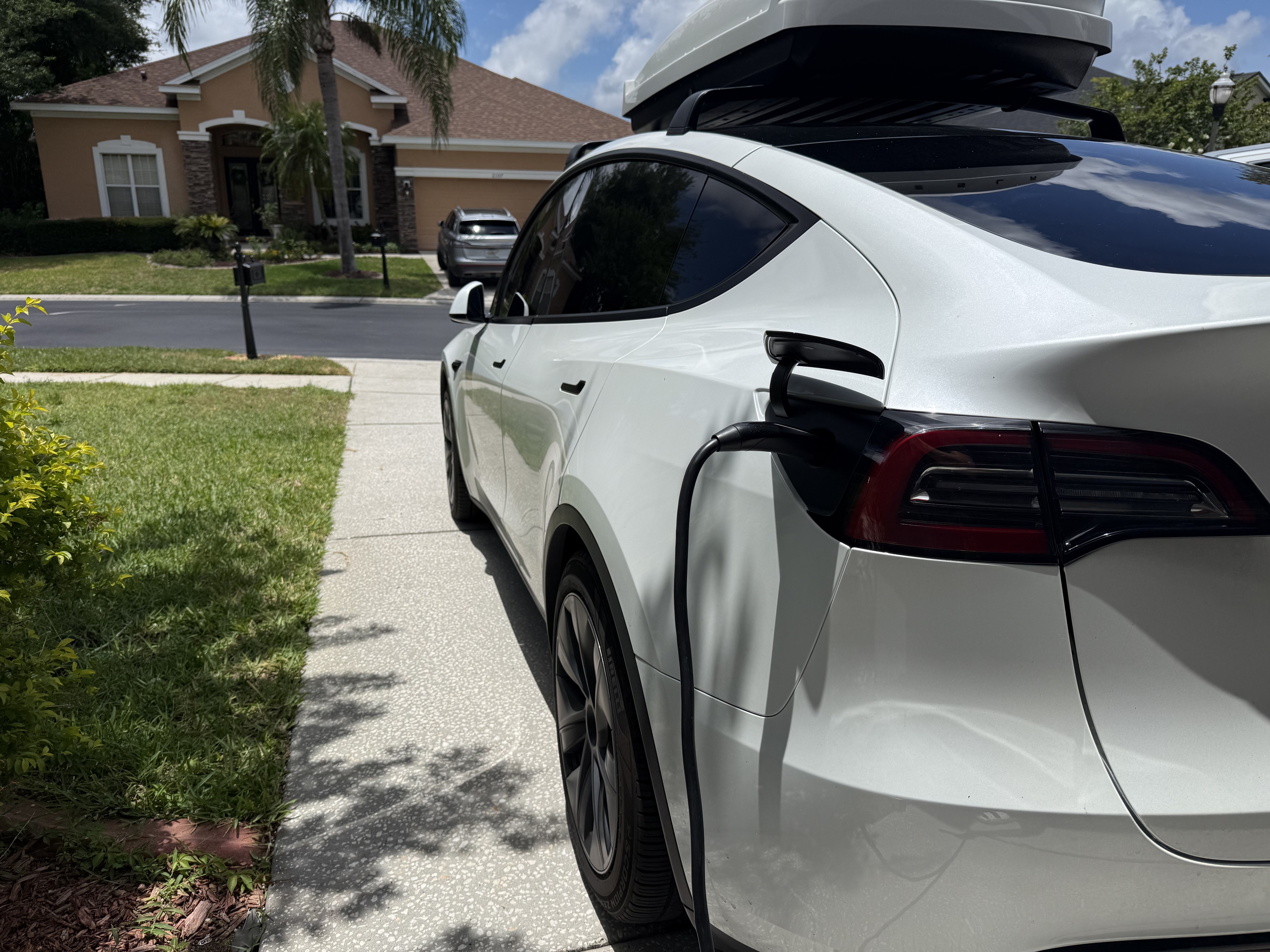 EV connected to a home charger after installation in Tampa Bay