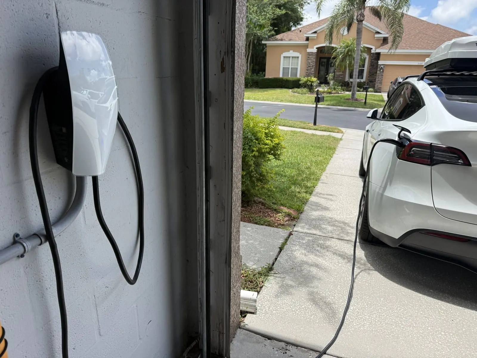 Level 2 EV charger wall connector mounted in a Tampa Bay garage