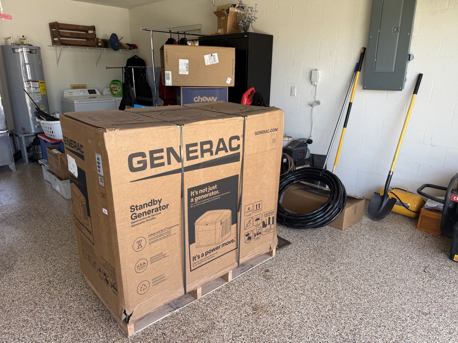 Generac standby generator delivered on a pallet in a Tampa Bay garage before installation