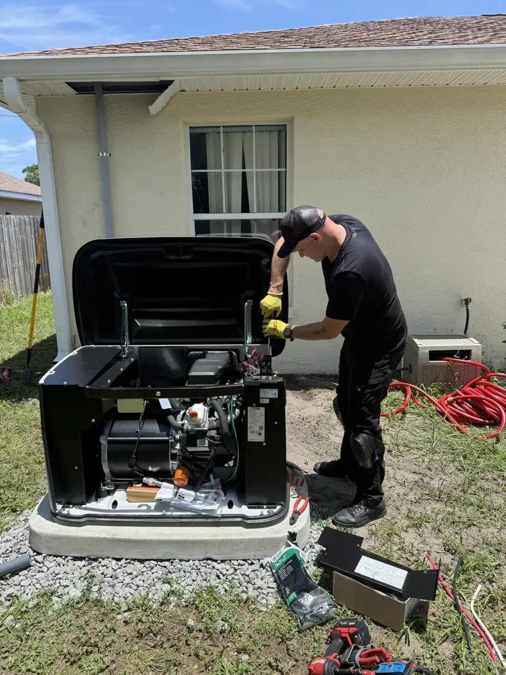 Fixer Service technician wiring the generator control panel in Tampa Bay