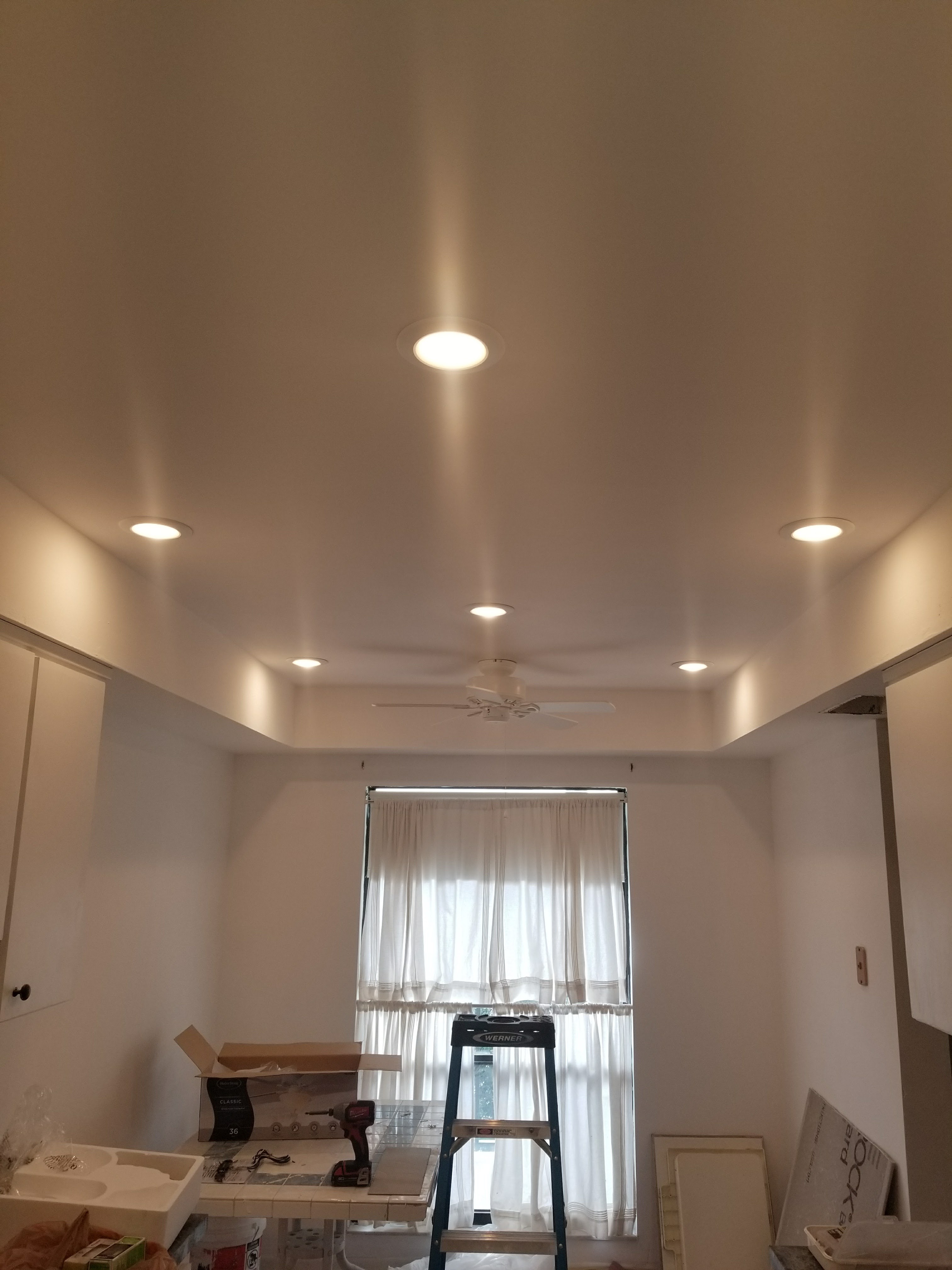 Recessed lighting installed across a living room ceiling in Tampa Bay