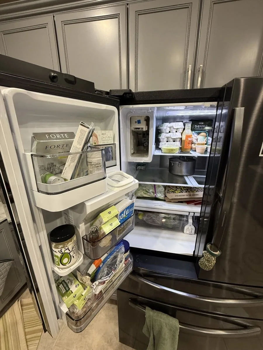 Refrigerator pulled open for inspection — checking internal components in Tampa Bay home