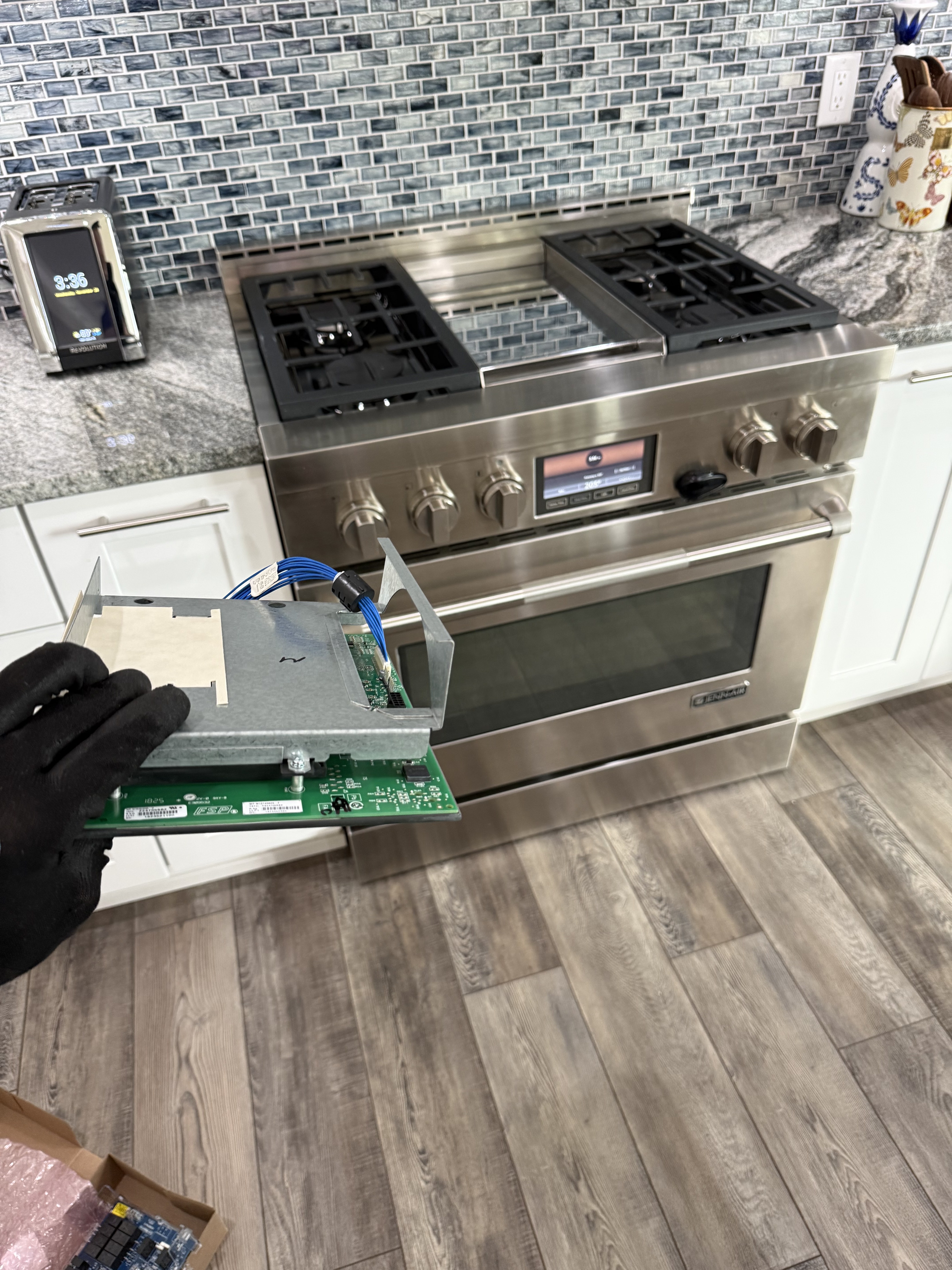 Stove control board accessed during a Tarpon Springs range repair