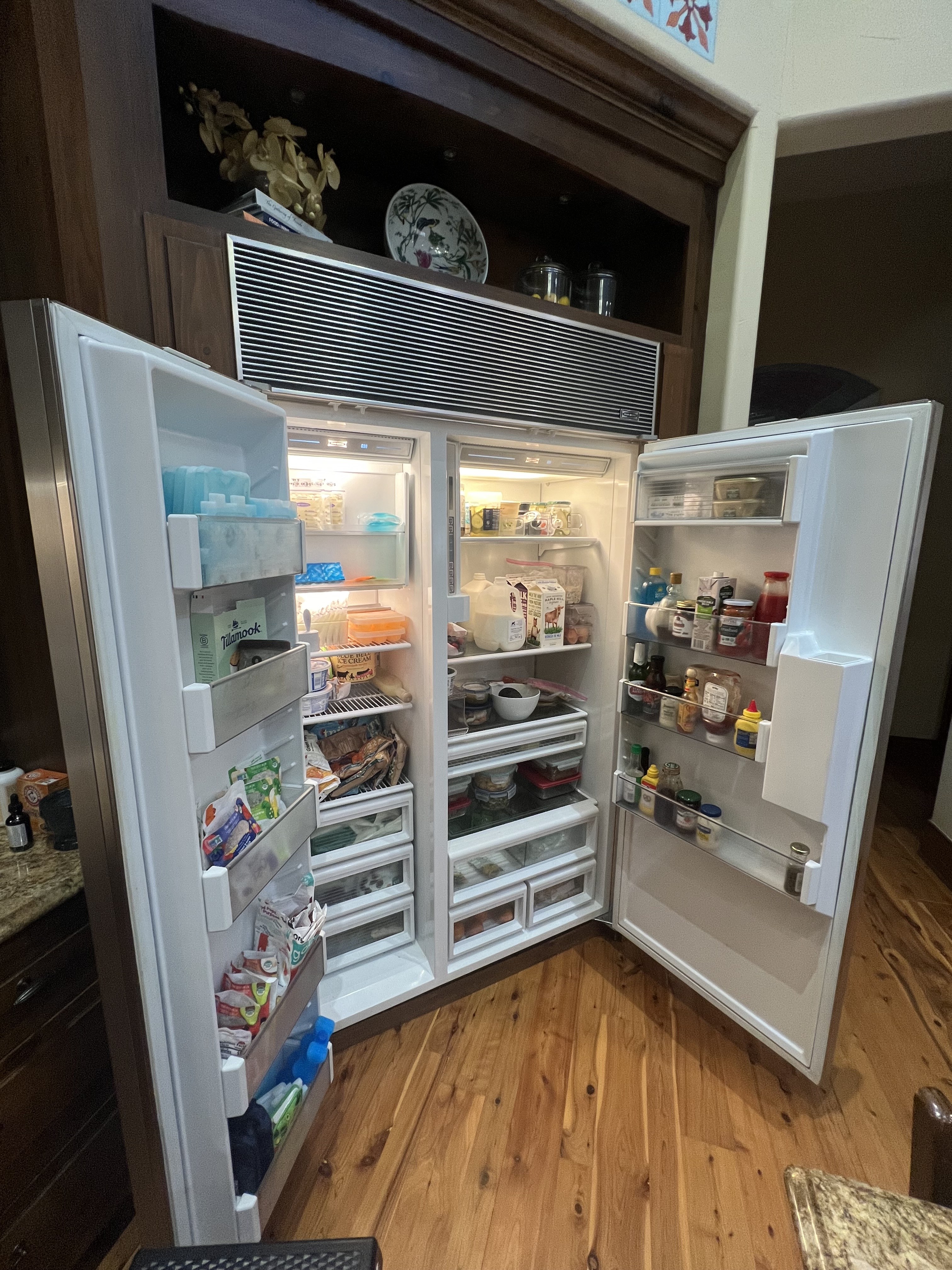 Sub-Zero built-in refrigerator with both doors open — Tampa Bay appliance repair