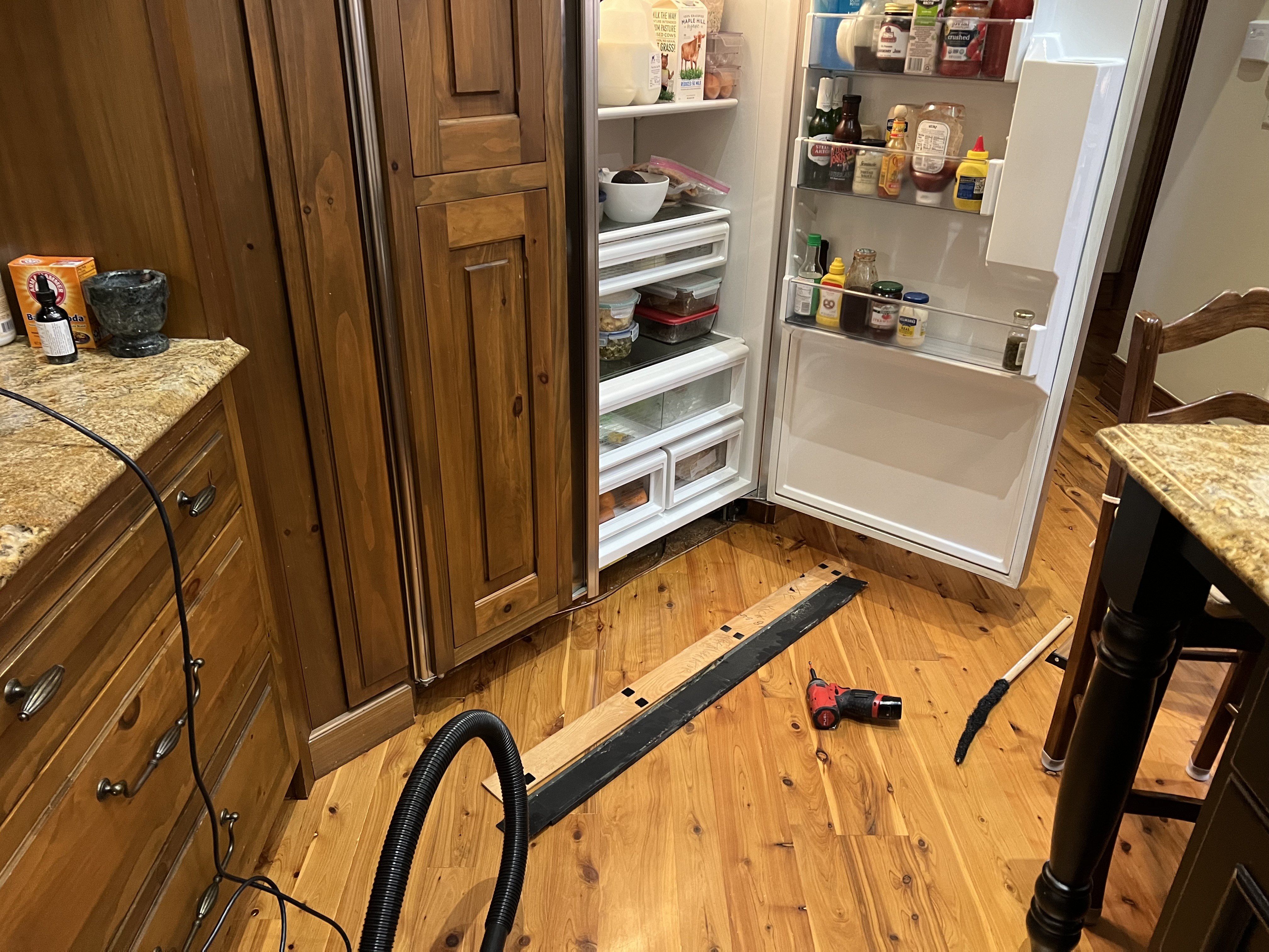 Fixer Service technician diagnosing a Sub-Zero refrigerator service call — Tampa Bay