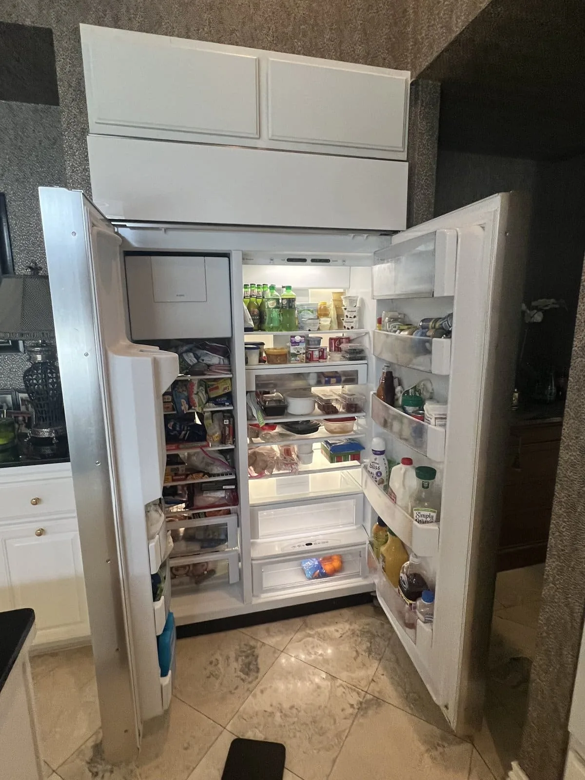Sub-Zero built-in side-by-side refrigerator open during Tampa Bay service call