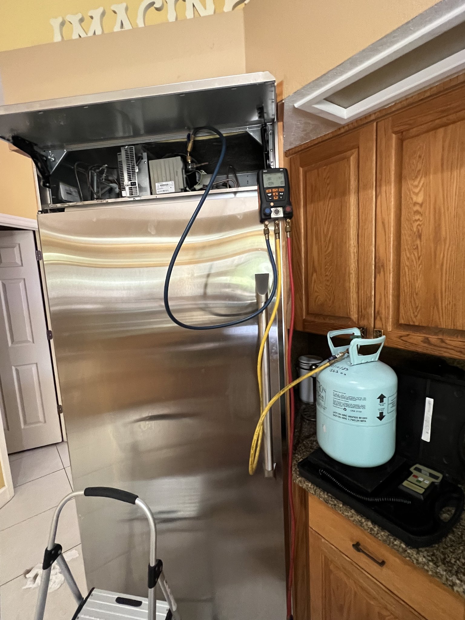 Viking refrigerator top compartment open showing control board and sealed-system access during a Tampa Bay diagnostic