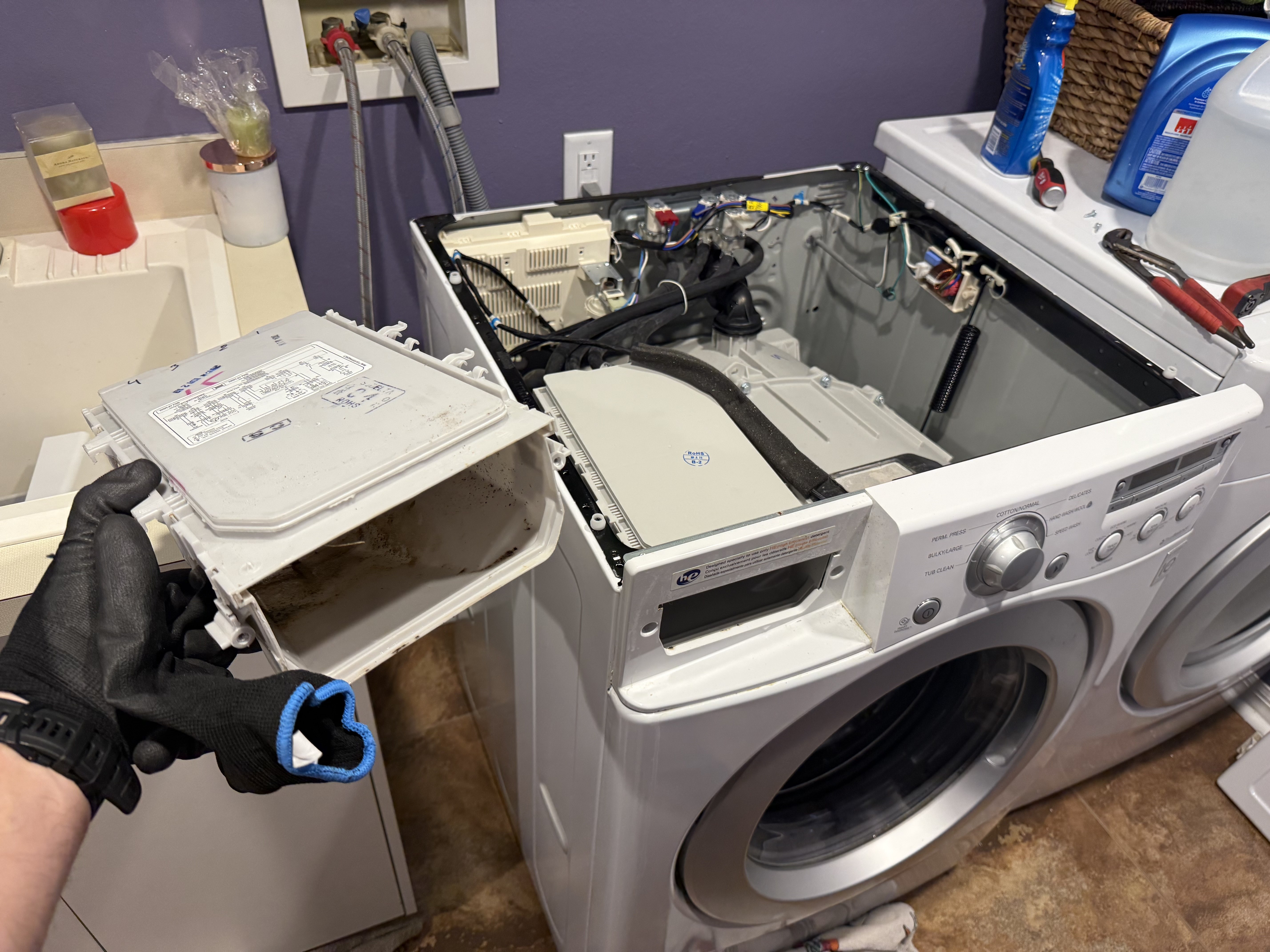 LG front-load washer disassembled during a Tampa Bay washer repair
